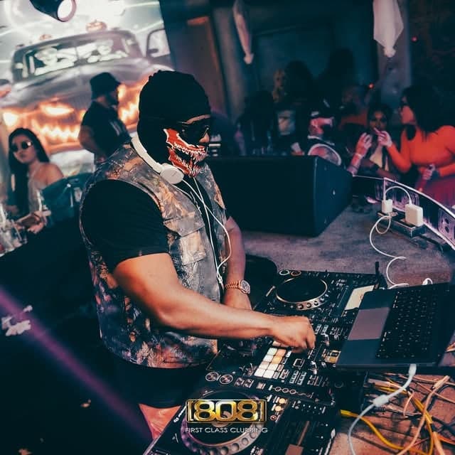 A DJ in skeleton make-up at the decks